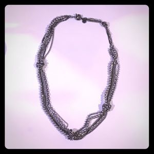 Silver knotted layer necklace.